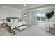 Bright bedroom with a large window, plush carpet, and modern decor, creating a serene atmosphere at 5528 Echo Hollow St, Castle Rock, CO 80104