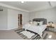 Bedroom with carpet, tray ceiling and a stylishly decorated bed at 5528 Echo Hollow St, Castle Rock, CO 80104