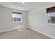 Comfortable bedroom featuring neutral tones, soft carpet, and a window offering natural light at 5528 Echo Hollow St, Castle Rock, CO 80104