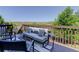 Cozy outdoor deck featuring stylish furniture, including a couch, chairs, and side tables with a view at 5528 Echo Hollow St, Castle Rock, CO 80104