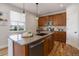 Beautiful kitchen with stainless steel appliances, a granite island, and ample cabinet space at 5528 Echo Hollow St, Castle Rock, CO 80104
