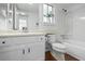 Cozy white bathroom with a combination tub and shower and wood-look flooring at 1248 W 135Th Ave, Denver, CO 80234