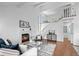 Living room featuring a fireplace, high ceilings, and a staircase leading to the upper level at 1248 W 135Th Ave, Denver, CO 80234