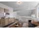 Stylish seating area featuring modern decor, complemented by natural light from a nearby window at 1248 W 135Th Ave, Denver, CO 80234