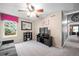 Comfortable bedroom with carpet, natural light, and modern ceiling fan at 8533 S Flower Ct, Littleton, CO 80128