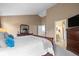 This spacious main bedroom boasts vaulted ceiling and neutral colors with ensuite bath at 8533 S Flower Ct, Littleton, CO 80128