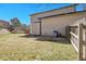 View of the house and yard with mature trees at 5126 S Malaya Way, Centennial, CO 80015