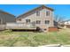 Enjoy the spacious yard with a deck and hot tub, perfect for entertaining at 5126 S Malaya Way, Centennial, CO 80015