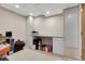 This basement is well lit with white walls and cabinets, and a desk at 5126 S Malaya Way, Centennial, CO 80015