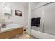 Bathroom with a vanity, framed mirror, toilet, and a shower with glass doors at 5126 S Malaya Way, Centennial, CO 80015