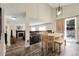 Open dining area with views of living room, fireplace and outside deck at 5126 S Malaya Way, Centennial, CO 80015