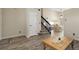 Open-concept entryway with wood floors, staircase, and natural lighting at 5126 S Malaya Way, Centennial, CO 80015