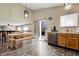 Bright kitchen area with wood floors, cabinetry, and sliding glass doors to outside deck at 5126 S Malaya Way, Centennial, CO 80015