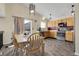 Eat-in kitchen with stainless steel appliances and access to outdoor deck at 5126 S Malaya Way, Centennial, CO 80015
