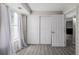 Bedroom featuring large window with curtains, and closet at 8843 Colorado Blvd # 208, Thornton, CO 80229