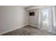 Bedroom featuring neutral decor, large window with curtains, and closet at 8843 Colorado Blvd # 208, Thornton, CO 80229