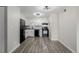 Bright kitchen features white cabinets, modern appliances, and hard surface countertops at 8843 Colorado Blvd # 208, Thornton, CO 80229