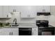 Modern kitchen with new appliances and granite countertops offers style and functionality at 8843 Colorado Blvd # 208, Thornton, CO 80229