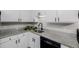 Updated kitchen with stainless steel sink, granite countertops, and modern fixtures at 8843 Colorado Blvd # 208, Thornton, CO 80229