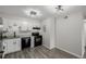 Bright kitchen features modern appliances, white cabinets and granite countertops at 8843 Colorado Blvd # 208, Thornton, CO 80229