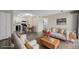Open floor plan showcasing a living room with modern furnishings flowing into the adjacent kitchen and dining area at 8843 Colorado Blvd # 208, Thornton, CO 80229