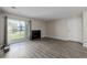 Open living room with sliding door access to the outdoor living space and a cozy fireplace at 8843 Colorado Blvd # 208, Thornton, CO 80229