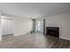 Bright open living room with fireplace and sliding door access to the outdoor living space at 8843 Colorado Blvd # 208, Thornton, CO 80229