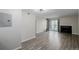 Open living room with sliding door access to the outdoor living space, and a cozy fireplace at 8843 Colorado Blvd # 208, Thornton, CO 80229