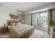 Main bedroom featuring deck access at 8843 Colorado Blvd # 208, Thornton, CO 80229