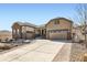 Charming two-story home with stone accents, a three-car garage, and a beautifully landscaped front yard at 3981 Old Oaks St, Castle Rock, CO 80104