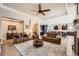 Spacious living room with wood floors, tray ceiling, and open layout, perfect for entertaining and relaxation at 3981 Old Oaks St, Castle Rock, CO 80104