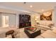 Relaxing living room features comfortable seating, built-in shelving, and soft lighting at 3981 Old Oaks St, Castle Rock, CO 80104