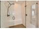 Modern glass shower with tiled walls, a built-in bench, and contemporary fixtures for a luxurious experience at 3981 Old Oaks St, Castle Rock, CO 80104