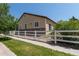 Well-maintained backyard with a decorative white picket fence and lush green lawn at 24664 E Louisiana Cir, Aurora, CO 80018
