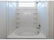 Bright bathroom with white tile surround and bathtub at 24664 E Louisiana Cir, Aurora, CO 80018
