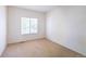 Neutral bedroom featuring carpet flooring, bright light, and ample closet space at 24664 E Louisiana Cir, Aurora, CO 80018