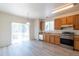 Bright kitchen featuring stainless steel appliances and hardwood floors at 24664 E Louisiana Cir, Aurora, CO 80018
