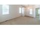 Bright living room featuring neutral carpet, plenty of natural light, and ample space at 24664 E Louisiana Cir, Aurora, CO 80018