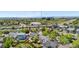Aerial view featuring a mix of homes in a suburban setting, with visible water towers and views of the surrounding landscape at 9638 Marion Way, Thornton, CO 80229
