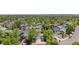 Wide aerial view of a suburban neighborhood with mature trees, manicured lawns, and a variety of home styles at 9638 Marion Way, Thornton, CO 80229