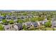 Expansive aerial view showcasing a neighborhood with lush greenery and diverse architectural styles of residential houses at 9638 Marion Way, Thornton, CO 80229