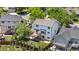 Backyard view of a two-story home featuring a spacious deck with stairs, a well-kept lawn, and privacy landscaping at 9638 Marion Way, Thornton, CO 80229