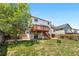 Landscaped backyard with multi-level deck and patio, providing ample outdoor living and entertaining space at 9638 Marion Way, Thornton, CO 80229