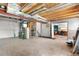 Unfinished basement with furnace and access to office at 9638 Marion Way, Thornton, CO 80229