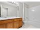 Bathroom includes double sinks and shower over tub at 9638 Marion Way, Thornton, CO 80229