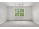 Large bedroom with big window and neutral colors at 9638 Marion Way, Thornton, CO 80229