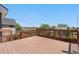 Large backyard deck featuring wood railings and open space for outdoor enjoyment and neighborhood views at 9638 Marion Way, Thornton, CO 80229