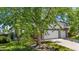 Exterior front view of a charming home featuring a well-manicured lawn and a spacious three-car garage at 9638 Marion Way, Thornton, CO 80229