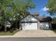 Charming home featuring an attached two-car garage, mature trees, and inviting curb appeal at 9638 Marion Way, Thornton, CO 80229