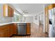 Bright open kitchen with stainless steel appliances and adjoining living area at 9638 Marion Way, Thornton, CO 80229